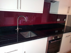 Red Glass Splash Back and Star Galaxy Granite Worktop Farringdon