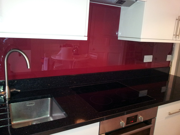 Red Glass Splash Back and Star Galaxy Granite Kitchen Worktop Farringdon